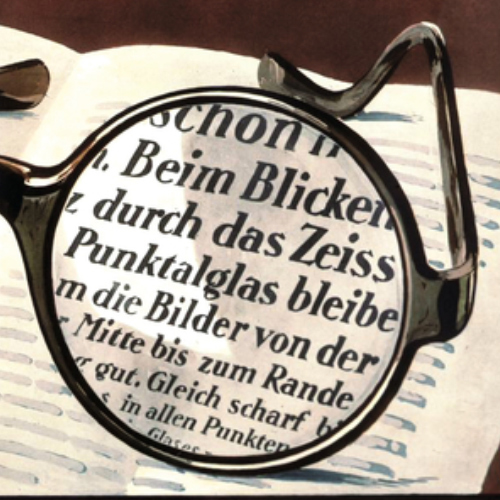 Obrázek staré reklamy na čočky ZEISS Punktal zobrazující ostrý zrak přes celou plochu čočky. To bylo v roce 1912 revoluční. 